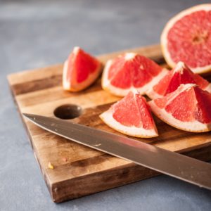 Sliced grapefruit on a cutting board